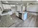 Modern kitchen with white cabinets, granite countertops, and stainless steel appliances at 2220 Church St, Sanford, FL 32771
