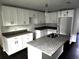 Modern kitchen with white cabinets and granite countertops at 2243 Greenway St, Sanford, FL 32771