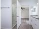Clean bathroom with a marble shower and white cabinets at 2261 Greenway St, Sanford, FL 32771
