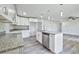 Modern kitchen with white shaker cabinets, granite countertops, and island at 2261 Greenway St, Sanford, FL 32771