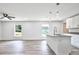 Modern kitchen with white shaker cabinets, granite countertops, and island at 2261 Greenway St, Sanford, FL 32771