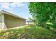 Backyard with lush green grass and mature trees at 2261 Greenway St, Sanford, FL 32771