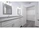 Updated bathroom with granite countertops, double sinks and a walk-in closet at 2261 Greenway St, Sanford, FL 32771