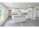 Modern kitchen with white shaker cabinets, granite countertops, and island at 2261 Greenway St, Sanford, FL 32771