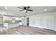 Open concept living room with vinyl plank flooring and ceiling fan at 2261 Greenway St, Sanford, FL 32771