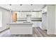 Modern kitchen with white shaker cabinets and granite countertops at 2261 Greenway St, Sanford, FL 32771