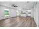 Open living room with vinyl plank flooring and kitchen island at 2261 Greenway St, Sanford, FL 32771