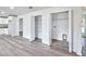 Bright laundry room with built-in shelving and vinyl flooring at 2261 Greenway St, Sanford, FL 32771