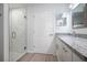 Elegant bathroom featuring a marble shower and a granite countertop at 2261 Greenway St, Sanford, FL 32771
