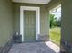 Front door entry with a covered porch and brick pavers at 2261 Greenway St, Sanford, FL 32771