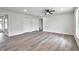 Spacious living room featuring vinyl plank flooring and ample natural light at 2261 Greenway St, Sanford, FL 32771