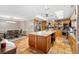 Eat-in kitchen with granite island and wood cabinetry at 2804 Dike Rd, Winter Park, FL 32792