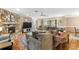 Spacious living room with a stone fireplace and comfortable seating at 2804 Dike Rd, Winter Park, FL 32792