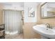 Updated bathroom with a pedestal sink and shower/tub combo at 2804 Dike Rd, Winter Park, FL 32792