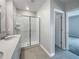 Clean bathroom with a walk-in shower and double vanity at 6931 Wilson Pasture Ave, Groveland, FL 34736
