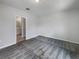 Comfortable bedroom with ensuite bathroom access and neutral decor at 6931 Wilson Pasture Ave, Groveland, FL 34736