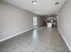 Bright and spacious living room with tile floors and an open floor plan at 6931 Wilson Pasture Ave, Groveland, FL 34736