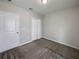Spacious bedroom with plush carpeting and ample closet space at 6931 Wilson Pasture Ave, Groveland, FL 34736
