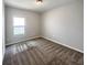 Spacious bedroom with neutral walls and carpeted floors at 6931 Wilson Pasture Ave, Groveland, FL 34736