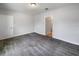 Well-lit bedroom with access to a nearby bathroom at 6931 Wilson Pasture Ave, Groveland, FL 34736