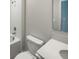 Simple bathroom with a bathtub, toilet and vanity at 6931 Wilson Pasture Ave, Groveland, FL 34736