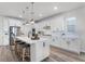 Modern kitchen with white cabinets, island, and stainless steel appliances at 10355 Parkview Reserve Ln, Orlando, FL 32836