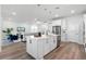 Modern kitchen with white cabinets, quartz countertops, and an island at 10355 Parkview Reserve Ln, Orlando, FL 32836