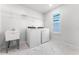 Convenient laundry room with washer, dryer and sink at 10355 Parkview Reserve Ln, Orlando, FL 32836