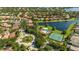 Aerial view of community amenities including a lake, pool, and tennis courts at 1361 Whitney Isles Dr, Windermere, FL 34786