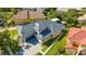 Luxury home with a gray tile roof, driveway and landscaping at 1361 Whitney Isles Dr, Windermere, FL 34786