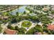 Aerial view of a community with a circular fountain and lush landscaping at 1361 Whitney Isles Dr, Windermere, FL 34786