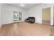 Living room with laminate flooring and sliding glass doors to patio at 3502 Windy Walk Way # 2104, Orlando, FL 32837