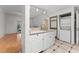 Kitchen with granite countertop, stainless steel sink, and laundry closet at 3502 Windy Walk Way # 2104, Orlando, FL 32837