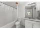 Updated bathroom with white vanity and black and white tile floor at 3502 Windy Walk Way # 2104, Orlando, FL 32837