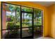 Screened porch overlooking a pond and lush landscaping at 3502 Windy Walk Way # 2104, Orlando, FL 32837