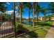 Community features a pond, palm trees, and pool at 3502 Windy Walk Way # 2104, Orlando, FL 32837