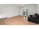 Spacious living room with wood floors and sliding glass doors to patio at 3502 Windy Walk Way # 2104, Orlando, FL 32837