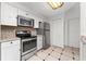 Updated kitchen, featuring stainless steel appliances and granite countertops at 3502 Windy Walk Way # 2104, Orlando, FL 32837