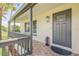 Inviting home exterior featuring a covered porch and stylish front door at 1232 Bel Aire Dr, Daytona Beach, FL 32118