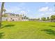 Spacious backyard with a large grassy area and a fenced perimeter at 1232 Bel Aire Dr, Daytona Beach, FL 32118