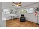 Bright home office features hardwood floors, built-in desk, and comfortable armchair at 1232 Bel Aire Dr, Daytona Beach, FL 32118