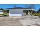 New construction home with green exterior and white garage door at 2453 Broadway St, Sanford, FL 32771