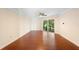 Bright and airy bedroom with hardwood floors and access to a balcony at 201 Tranquility Cv, Altamonte Springs, FL 32701