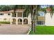 House exterior with brick driveway and lush landscaping at 201 Tranquility Cv, Altamonte Springs, FL 32701