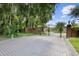 Gated community entrance with brick pavers and lush landscaping at 201 Tranquility Cv, Altamonte Springs, FL 32701