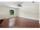 Bright living room with hardwood floors and large window at 201 Tranquility Cv, Altamonte Springs, FL 32701