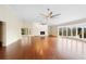 Large living room with hardwood floors, fireplace, and water views at 201 Tranquility Cv, Altamonte Springs, FL 32701