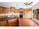 Modern kitchen with dark wood cabinets and granite countertops at 201 Tranquility Cv, Altamonte Springs, FL 32701
