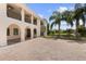 Two-story house with a brick driveway and palm trees at 201 Tranquility Cv, Altamonte Springs, FL 32701