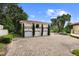 Three-car garage with second-floor bonus room and paver driveway at 201 Tranquility Cv, Altamonte Springs, FL 32701